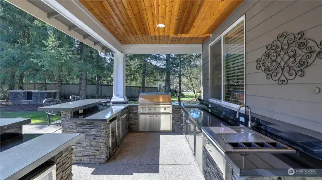 Step outside to this exquisite covered outdoor kitchen!