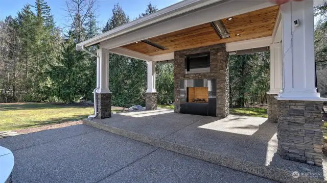 Craftsman style gazebo with heaters and fireplace.