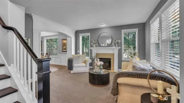 Stunning formal living room, to the right of entry, notice the detailed archway into the formal dining room.