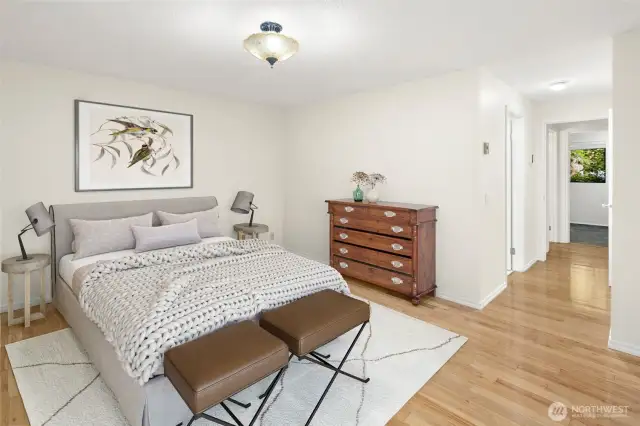 Primary bedroom with wood floors