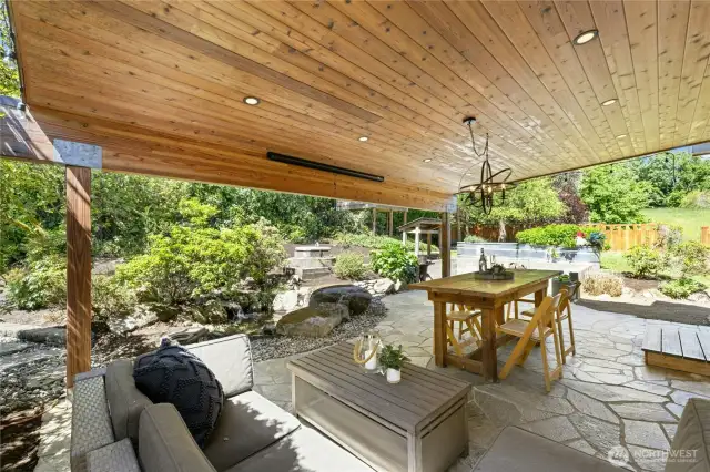 The pull down projector screen is perfect for outdoor movie nights! A lovely water feature is to the left.