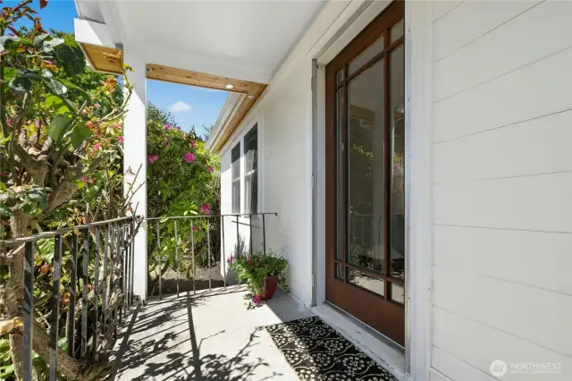 Covered front entry welcomes guests.