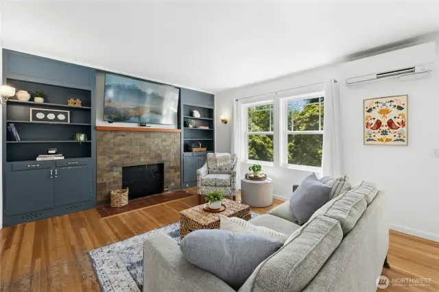 The living room has original fir floors. An electric fireplace insert is being installed.