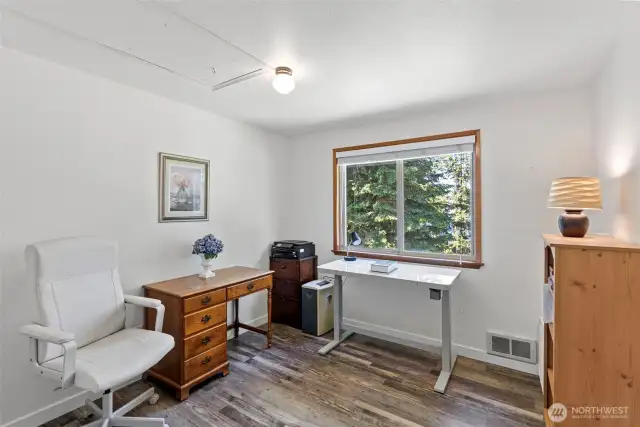 Bedroom 3, with a partial view of Henderson bay.
