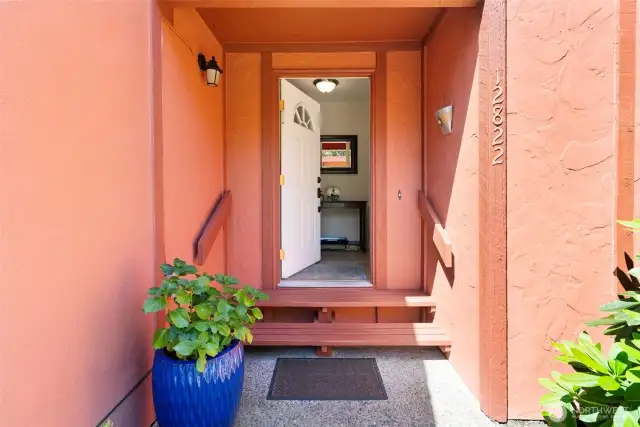 The front pathway welcomes guest to a foyer and living room.