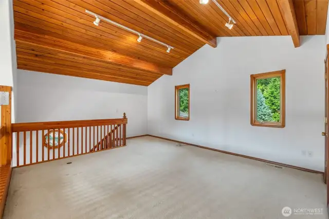 The loft area can serve as a bedroom, family room, or office.