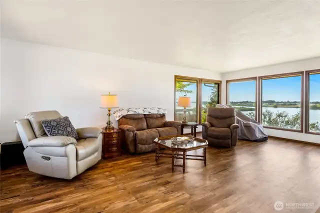 When you're in the living room, no matter where you sit, you can always see the expansive view of the lake with the floor to ceiling windows.