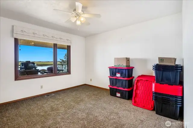 Bedroom #1 is upstairs and faces the lake and main level deck. With the ceiling fan going, it helps circulate the central air to keep it cool. This bedroom has brand new carpeting!