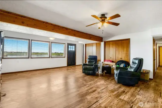 Open the blinds in the living room and you'll see the amazing view of the lake again.  The black door is outside access to the backyard, the lake, and covered patio.