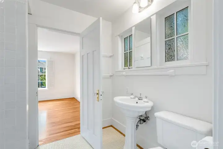 A jack-and-jill styled bathroom adjoins the front bedroom...