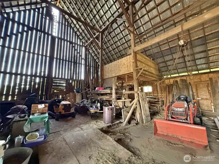 1940's barn with old hay mow and a newer loft. Lots of storage and machinery is available/negotiable  if interested.