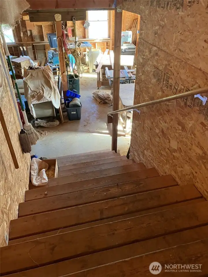 Wide staircase to the bonus room above studio. Very versatile.
