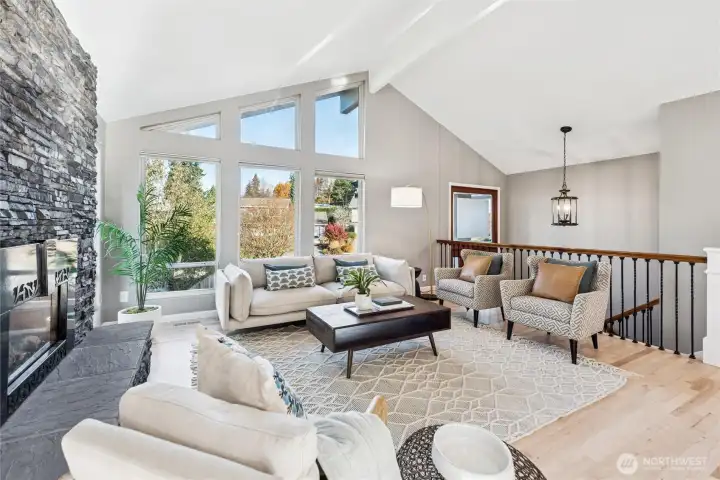 Looking back at the entry, the hardwood flooring flows through the LR, DR, Kitchen, stairs and hallway of the upper floor.