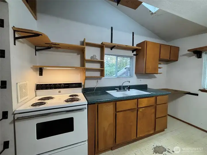 Cozy kitchen with plenty of custom-built shelves