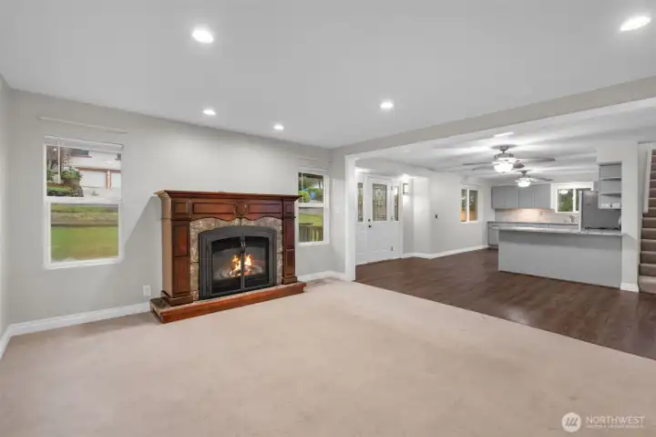 Family room off kitchen with lovely gas fireplace.