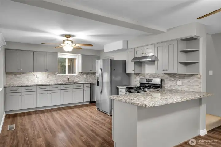 Roomy kitchen with lots of storage and breakfast bar.