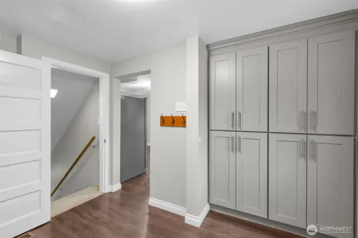 Main floor laundry room has additional storage and access to lower level.