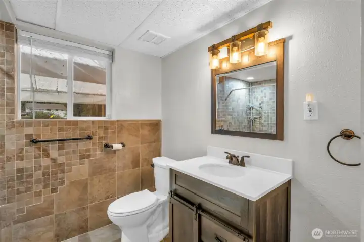 Lower level 3/4 remodeled bathroom.