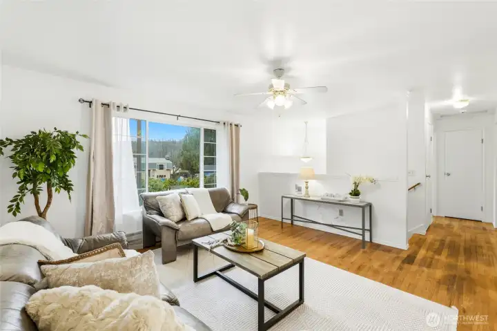 Large window allow for tons of natural light. Leading down hallway to 2 bedrooms and full bathroom and tons of storage.