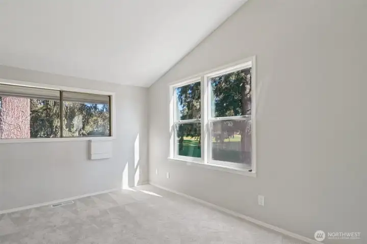 Light filled corner bedroom with walk in closet
