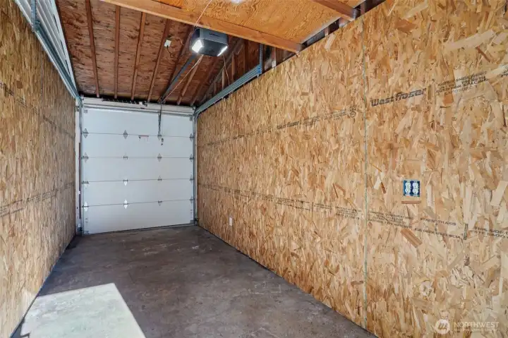 Golf cart garage accessible from front or back of house, but garage door faces the back side of house