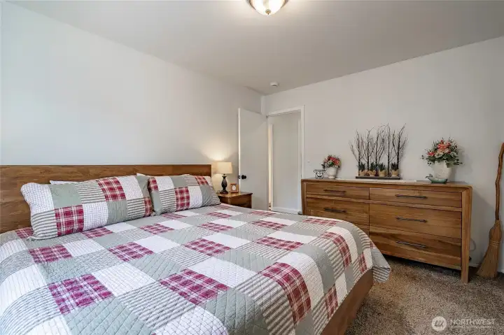 Primary Bedroom with attached 3/4 Bath and walk-in closet.