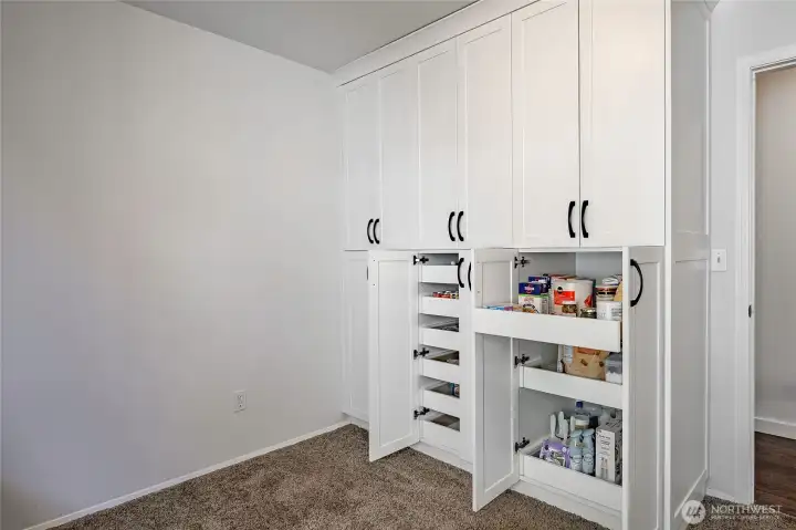 Bedroom 2 showing custom cloets.