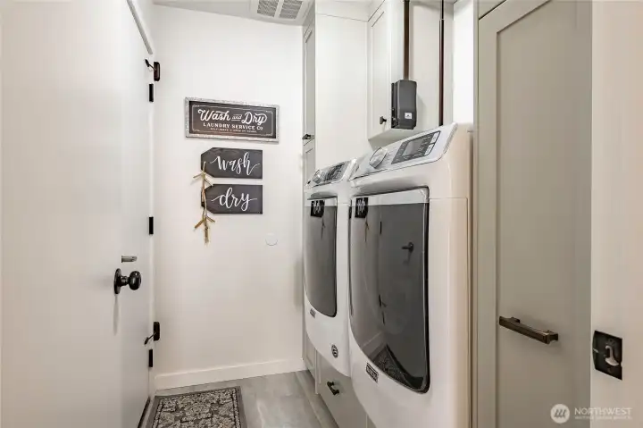 Laundry room plus clever built-in cabinets.