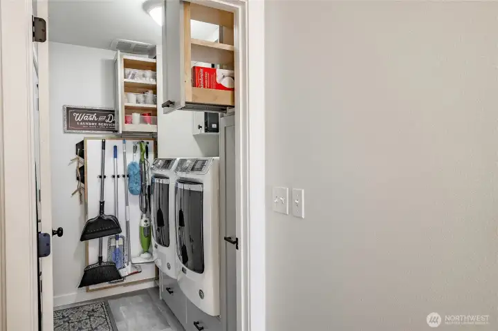 Picture shows clever slide out cabinets both up & bottom to maximize storage space.