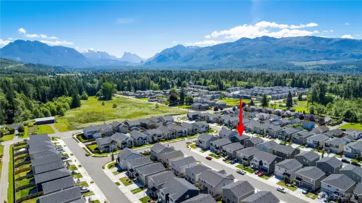 Drone view of neighborhood with Cascades in view
