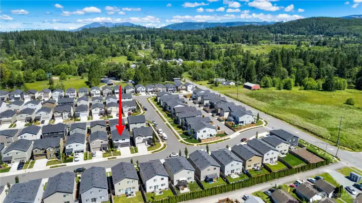 Drone view of neighborhood with Cascades in view