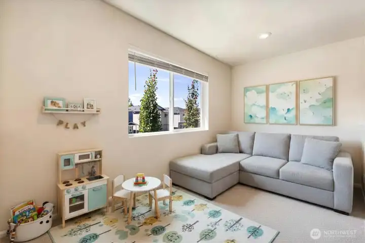 Upstairs loft currently used as playroom (virtually staged)