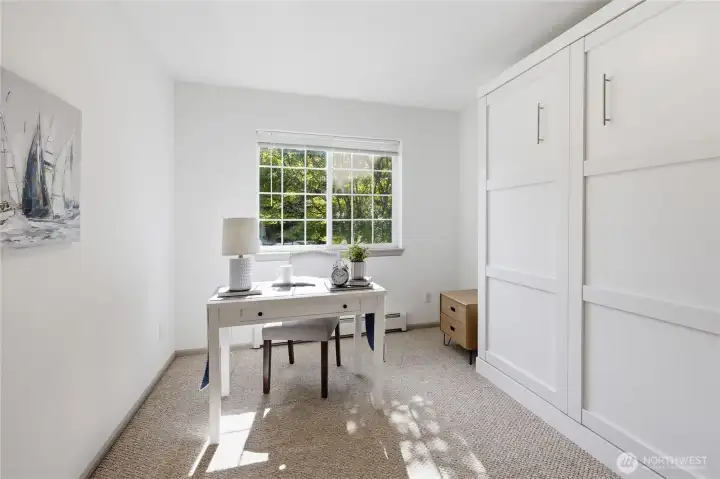One of three upstairs bedrooms has a murphy bed.