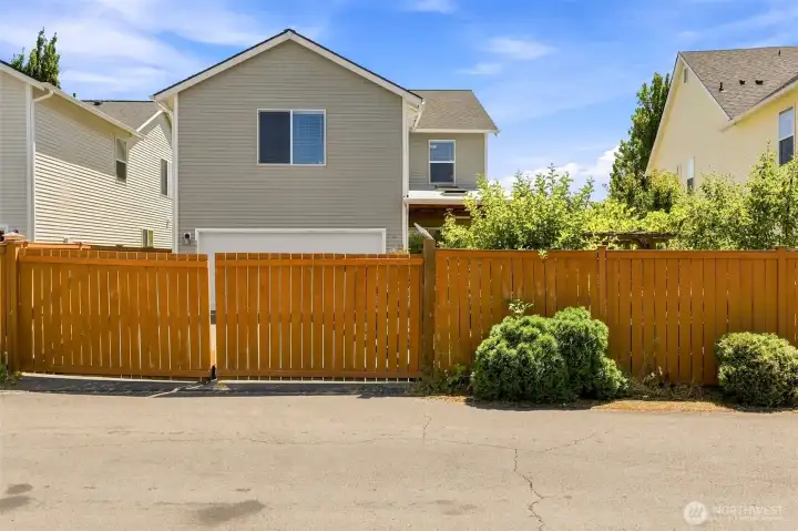 Gated Alley Entry to Driveway and 2-car Garage