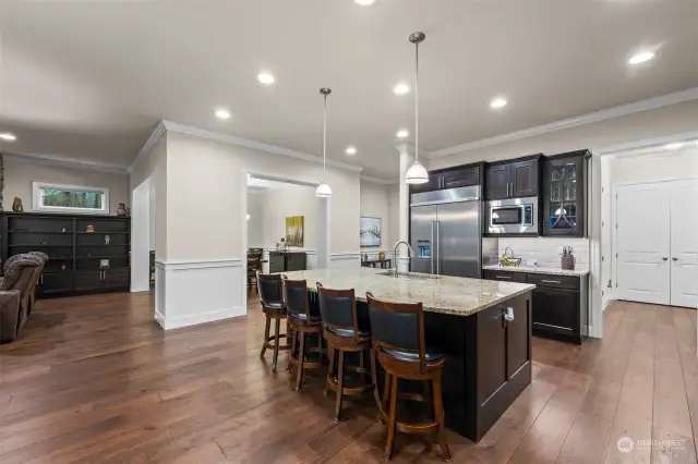 Kitchen features a large island with granite countertop, sink in the island and plenty of room for seating!