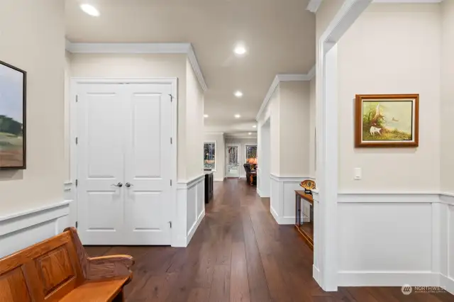 As you enter, you'll immediately appreciate the attention to detail—featuring elegant wainscoting, soaring 10' ceilings, engineered hardwood floors, and recessed lighting throughout.