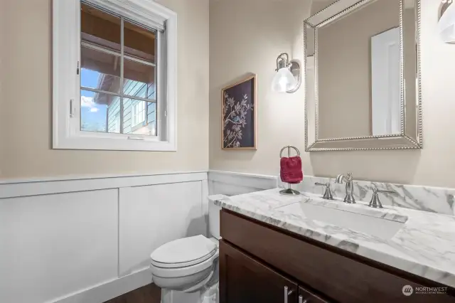 Elegant downstairs guest bathroom, conveniently located near the entryway.