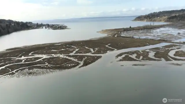 Drone view from above property.  Note Sandy Hook community in the top left and shipping lanes above with the Olympic Peninsula across the water.