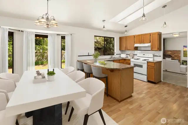 Come on into the kitchen and have this open concept for cooking with an eye on your fenced in backyard.