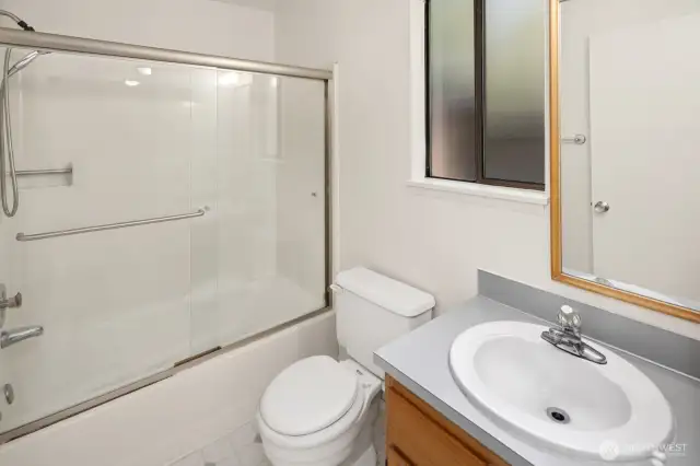 en suite, full bath which backs up to the back of the house-- french doors for watching the stars before bed.