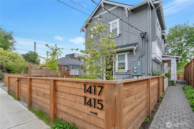 This is the neighbors condo at the street front. The subject condo is in the back. It's free standing. No adjoining walls to other condo.