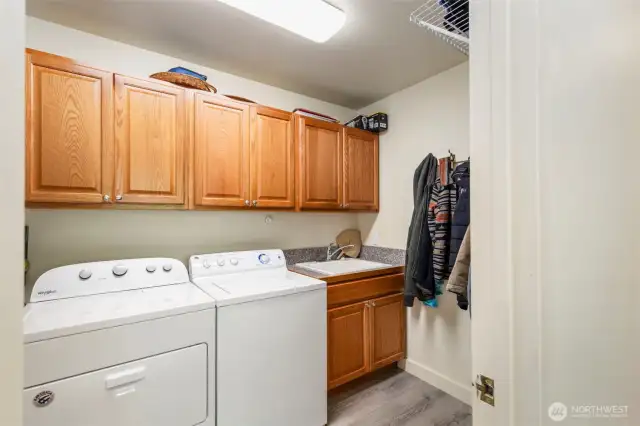 Laundry off the office, with plenty of storage and sink.