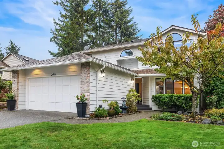 Large two car garage with built-in shelving and workbench. Plenty of room for your vehicles plus  extra storage space.