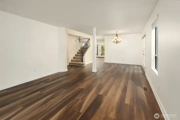 Living room/ dining room area is spacious, light and bright, and offers endless possibilities with two gathering areas on the main floor.