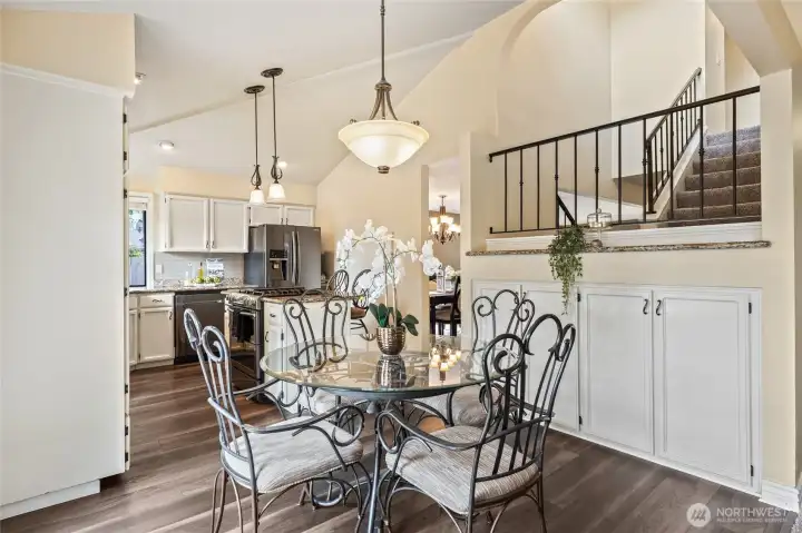 Tall ceilings, open staircase, and extra bonus cabinet space for expanded pantry or games/toy closet.