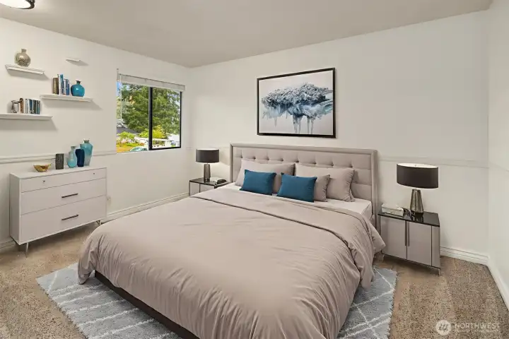 Another upstairs bedroom with new lighting and closet with built-ins. (Digitally staged).