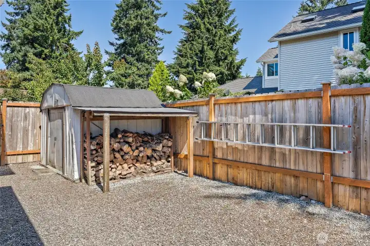 The side yard includes storage shed for yard tools and gardening supplies, or perfect to store bikes and outdoor toys.