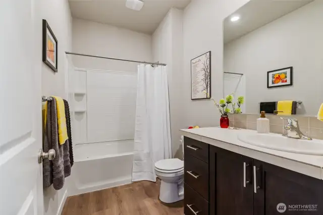 Guest Bathroom with tub/shower combo. situated between bedrooms #3 & #4.