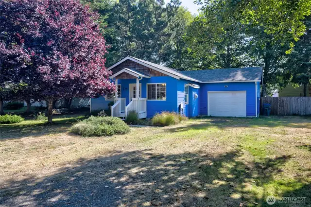 Surrounded by greenery, this charming home boasts - a new roof (2021), New paint (2021-22), New water heater (2018-19), Newer fenced backyard, Surveyed, RV Hookup +more!