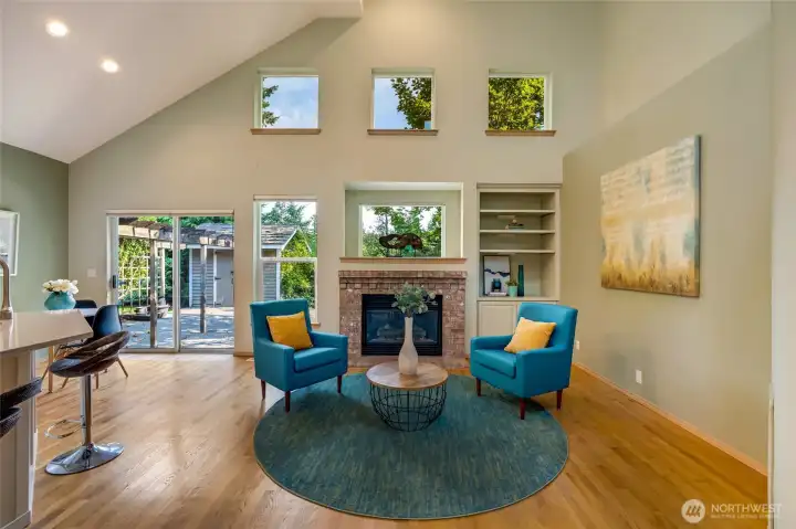 Kitchen and family room with vaulted ceiling extra windows and gas insert.